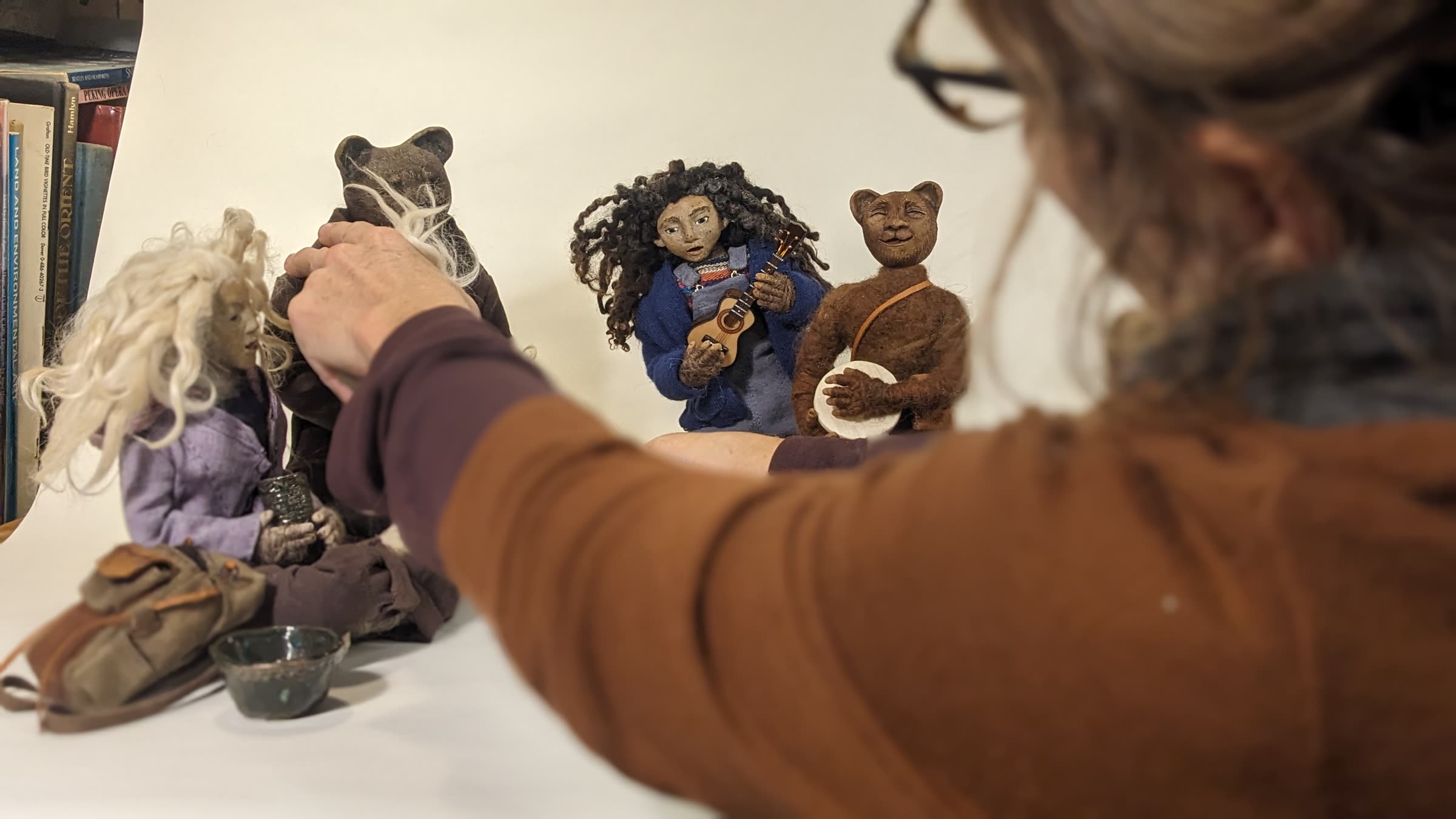 the artist at work with the puppets